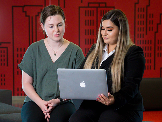 Women collaborating on laptop